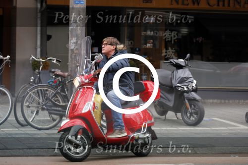 Amsterdam 9 maart 2015 
Martijn Krabbe doet boodschappen op zijn vespa scooter.