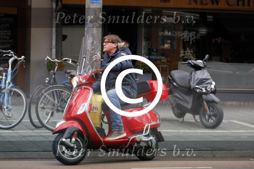 Amsterdam 9 maart 2015 
Martijn Krabbe doet boodschappen op zijn vespa scooter.