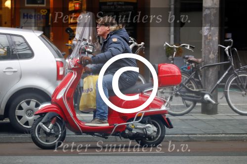 Amsterdam 9 maart 2015 
Martijn Krabbe doet boodschappen op zijn vespa scooter.