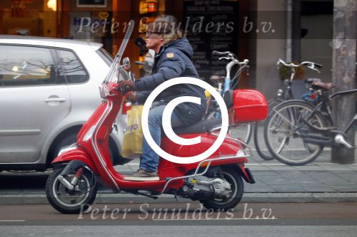 Amsterdam 9 maart 2015 
Martijn Krabbe doet boodschappen op zijn vespa scooter.