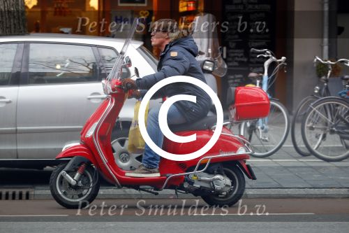 Amsterdam 9 maart 2015 
Martijn Krabbe doet boodschappen op zijn vespa scooter.