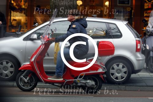Amsterdam 9 maart 2015 
Martijn Krabbe doet boodschappen op zijn vespa scooter.