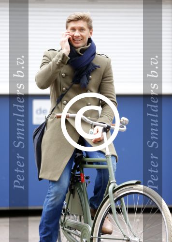 Amsterdam 20 maart 2016 
Evgeniy Levchenko bellend op zijn fiets in amsterdam zuid.