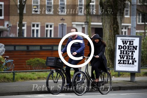 Amsterdam 23 maart 2016 
Gijs Staverman met (een) vriendin op de fiets in Amsterdam.