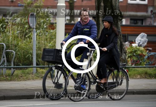 Amsterdam 23 maart 2016 
Gijs Staverman met (een) vriendin op de fiets in Amsterdam.
