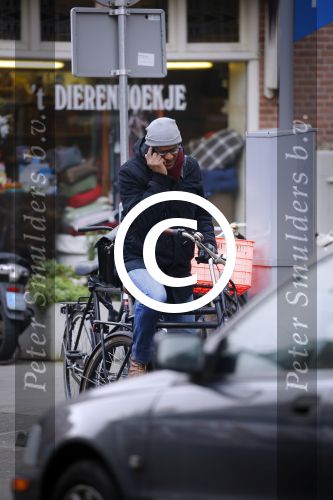 Amsterdam 11 maart 2016
Jimmy Geduld bellend op straat.
