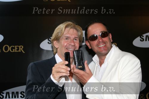 Amsterdam, 12 Juli 2006
Presentatie nieuw GSM Toestel type van Samsung X820 i.s.m. met Oger.  Addy v d Krommenacker met zijn vriend