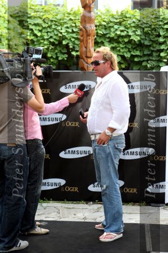 Amsterdam, 12 Juli 2006
Presentatie nieuw GSM Toestel type van Samsung X820 i.s.m. met Oger.  Gordon met een nieuw kapsel