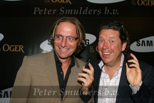Amsterdam, 12 Juli 2006
Presentatie nieuw GSM Toestel type van Samsung X820 i.s.m. met Oger.  Henkjan Smits samen met Eric v Tijn