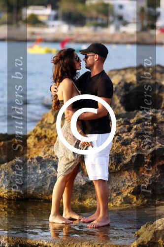 Ibiza 10 juli 2012
Wesley Sneijder en zijn vrouw Yolanthe Sneijder Cabau verliefd op ibiza genieten van de ondergaande zon.
Peter Smulders bv
