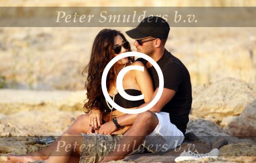 Ibiza 10 juli 2012
Wesley Sneijder en zijn vrouw Yolanthe Sneijder Cabau verliefd op ibiza genieten van de ondergaande zon.
Peter Smulders bv