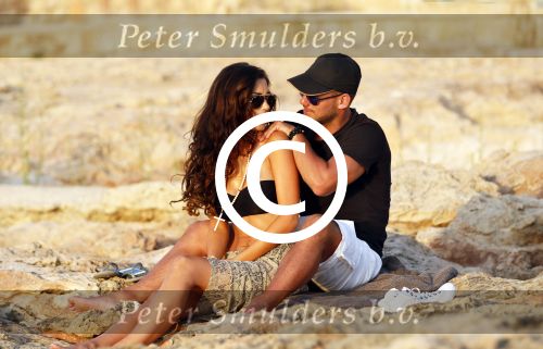 Ibiza 10 juli 2012
Wesley Sneijder en zijn vrouw Yolanthe Sneijder Cabau verliefd op ibiza genieten van de ondergaande zon.
Peter Smulders bv
