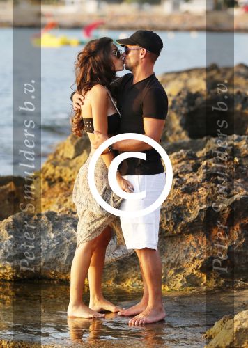 Ibiza 10 juli 2012
Wesley Sneijder en zijn vrouw Yolanthe Sneijder Cabau verliefd op ibiza genieten van de ondergaande zon.
Peter Smulders bv