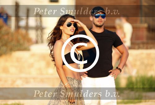Ibiza 10 juli 2012
Wesley Sneijder en zijn vrouw Yolanthe Sneijder Cabau verliefd op ibiza genieten van de ondergaande zon.
Peter Smulders bv