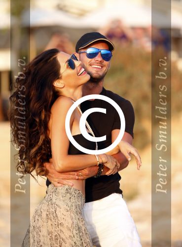 Ibiza 10 juli 2012
Wesley Sneijder en zijn vrouw Yolanthe Sneijder Cabau verliefd op ibiza genieten van de ondergaande zon.
Peter Smulders bv