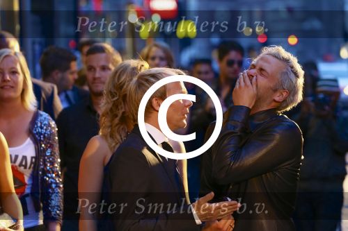 AMSTERDAM - Bij het Tuschinski Theater is de premiere van Behind the Candelabra. Met op de rode loper  Derek Ogilvie met Paul Turner