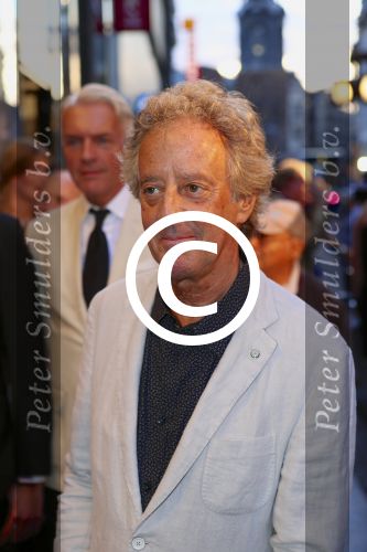 AMSTERDAM - Bij het Tuschinski Theater is de premiere van Behind the Candelabra. Met op de rode loper  Hans v Willigenburg.