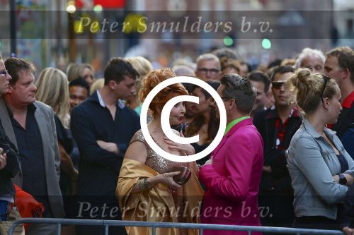 AMSTERDAM - Bij het Tuschinski Theater is de premiere van Behind the Candelabra. Met op de rode loper  Henk Krol en zijn partner Reon Nettenbreijers.