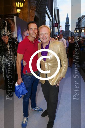 AMSTERDAM - Bij het Tuschinski Theater is de premiere van Behind the Candelabra. Met op de rode loper  Marcel van den Eng met Frits Huffnagel.