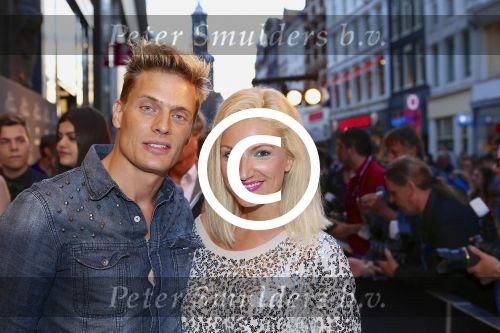 AMSTERDAM - Bij het Tuschinski Theater is de premiere van Behind the Candelabra. Met op de rode loper  Winston Post is met partner Denise van Rijswijk.