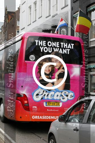 Amsterdam 15 augustus 2015
Tim Douwsma en  VajÃ¨n van den Bosch de hoofdrolspelers van de musical Grease staan groot op de bus