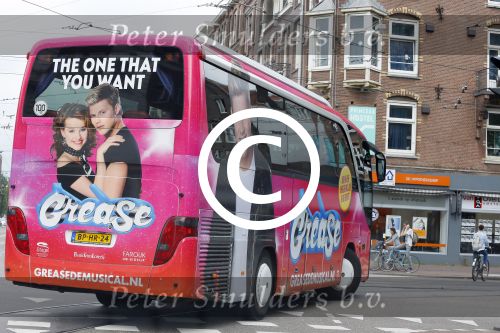 Amsterdam 15 augustus 2015
Tim Douwsma en  VajÃ¨n van den Bosch de hoofdrolspelers van de musical Grease staan groot op de bus