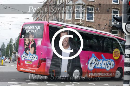 Amsterdam 15 augustus 2015
Tim Douwsma en  VajÃ¨n van den Bosch de hoofdrolspelers van de musical Grease staan groot op de bus
