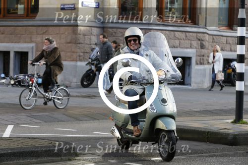 Amsterdam 28 november 2015  
Huub Stapel op zijn vespa scooter