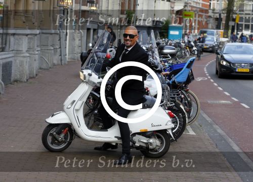 Amsterdam 23 november 2015
Maik de Boer op zijn vespa scooter op straat