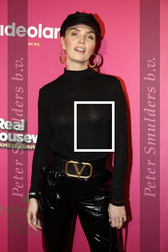 Amsterdam 22 november 2022
Presentatie Real Housewifes of Amsterdam in Hotel Krasnapolsky  van Videoland. Kim Feenstra kwam met haar partner Stanley Tailor en zijn moeder