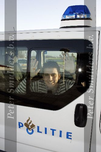Lelystad14 december 2005
jan Smit in politieauto bij vliegveld Lelystad.