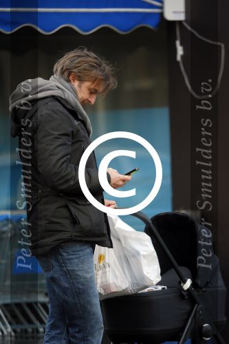 Amsterdam  11 januari 2014
Victor Reinier met vriendin en baby in kinderwagen.