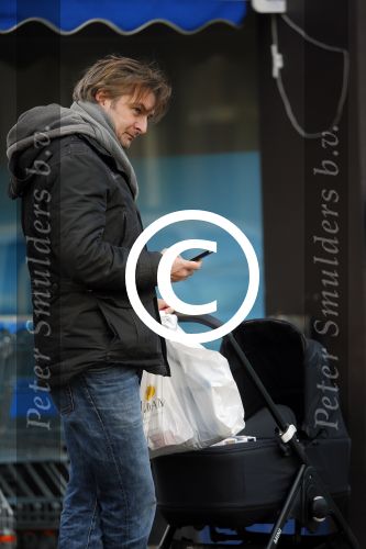 Amsterdam  11 januari 2014
Victor Reinier met vriendin en baby in kinderwagen.