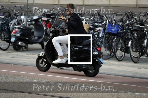 Amsterdam 11 juni 2018
Tim Douwsma op de scooter in het centrum van Amsterdam.