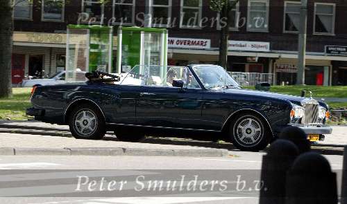 Amsterdam 18 juli 2003
Jack v Gelder in Rolls Royce Cabrio met zijn vrouw samen
op terras