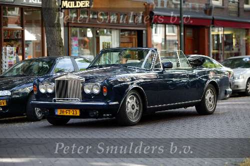 Amsterdam 18 juli 2003
Jack v Gelder in Rolls Royce Cabrio met zijn vrouw samen
op terras