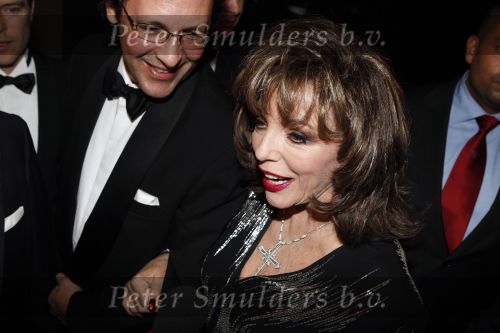 Amsterdam 6 december 2007
Miljonairsfair 2007 in de rai te amsterdam. Vip avond. Joan Collins opende de beurs samen met organisator Yves Gijraths. Joan met vriend
