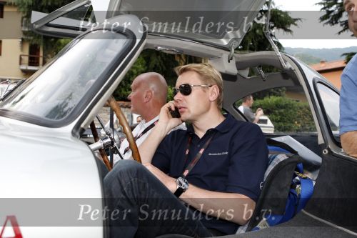 Brescia 15 mei 2008
Start van de Mille Miglia in Brescia. State of art rijdt met 2 porsches mee. 
Mika Hakkinen in een Merceders 300 SL