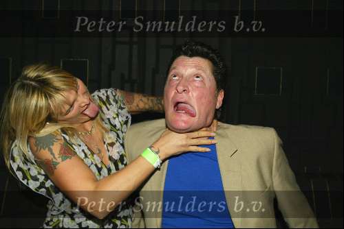 Amsterdam 3 maart 2004
Presentatie nieuw magazine Jacky in Jimmy Woo.
Barry Hay met vrouw met tatoeage