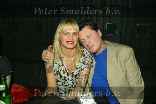 Amsterdam 3 maart 2004
Presentatie nieuw magazine Jacky in Jimmy Woo.
Barry Hay met vrouw tatoeage