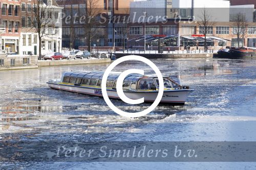 Amsterdam 4 februari 2012
Rondvaartboot op de grachten van amsterdam waar ijs ligt
Peter Smulders bv
