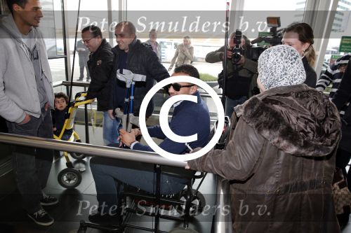 Schiphol 17 maart 2013
Badr Hari en Estelle Cruijff  komen terug van de K1 finale in Zagreb waar Badr zijn voet gebroken heeft . Badr wordt in een rolstoel naar zijn auto gebracht.
Peter Smulders bv