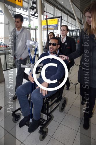 Schiphol 17 maart 2013
Badr Hari en Estelle Cruijff  komen terug van de K1 finale in Zagreb waar Badr zijn voet gebroken heeft . Badr wordt in een rolstoel naar zijn auto gebracht.
Peter Smulders bv