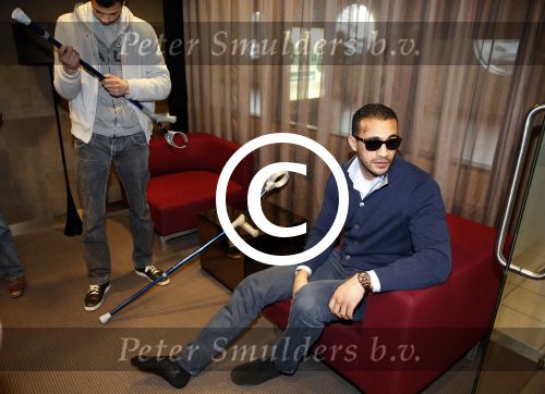 Schiphol 17 maart 2013
Badr Hari en Estelle Cruijff  komen terug van de K1 finale in Zagreb waar Badr zijn voet gebroken heeft . Badr wordt in een rolstoel naar zijn auto gebracht.
Peter Smulders bv