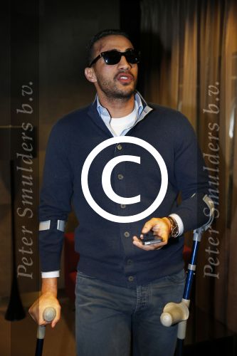 Schiphol 17 maart 2013
Badr Hari en Estelle Cruijff  komen terug van de K1 finale in Zagreb waar Badr zijn voet gebroken heeft . Badr wordt in een rolstoel naar zijn auto gebracht.
Peter Smulders bv