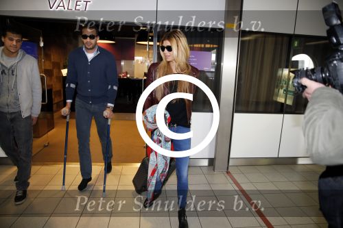 Schiphol 17 maart 2013
Badr Hari en Estelle Cruijff  komen terug van de K1 finale in Zagreb waar Badr zijn voet gebroken heeft . Badr wordt in een rolstoel naar zijn auto gebracht.
Peter Smulders bv