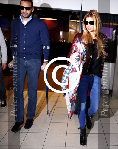 Schiphol 17 maart 2013
Badr Hari en Estelle Cruijff  komen terug van de K1 finale in Zagreb waar Badr zijn voet gebroken heeft . Badr wordt in een rolstoel naar zijn auto gebracht.
Peter Smulders bv