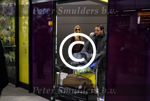 Schiphol 17 maart 2013
Badr Hari en Estelle Cruijff  komen terug van de K1 finale in Zagreb waar Badr zijn voet gebroken heeft . Badr wordt in een rolstoel naar zijn auto gebracht.
Peter Smulders bv