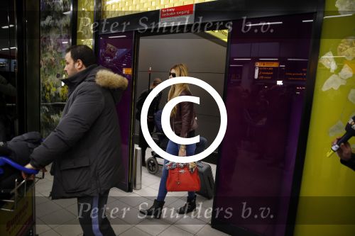 Schiphol 17 maart 2013
Badr Hari en Estelle Cruijff  komen terug van de K1 finale in Zagreb waar Badr zijn voet gebroken heeft . Badr wordt in een rolstoel naar zijn auto gebracht.
Peter Smulders bv