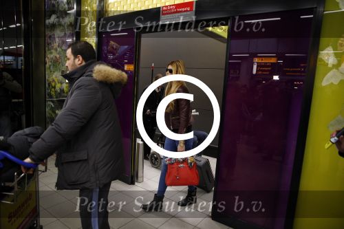Schiphol 17 maart 2013
Badr Hari en Estelle Cruijff  komen terug van de K1 finale in Zagreb waar Badr zijn voet gebroken heeft . Badr wordt in een rolstoel naar zijn auto gebracht.
Peter Smulders bv